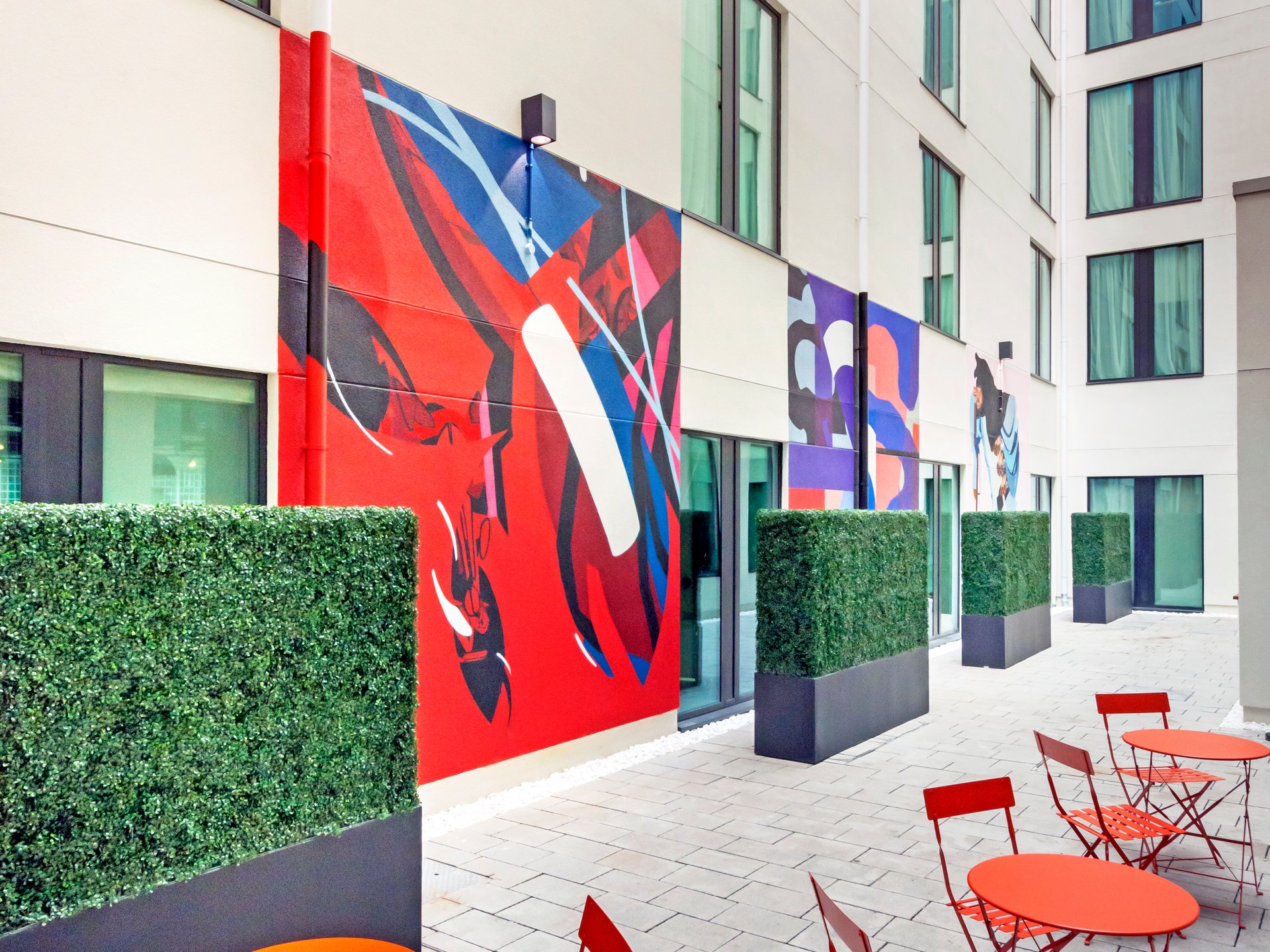 The Hendrick Smithfield courtyard seating area and graffiti on the walls