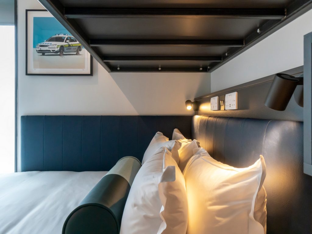 cosy hotel room details. Pillows and reading light.